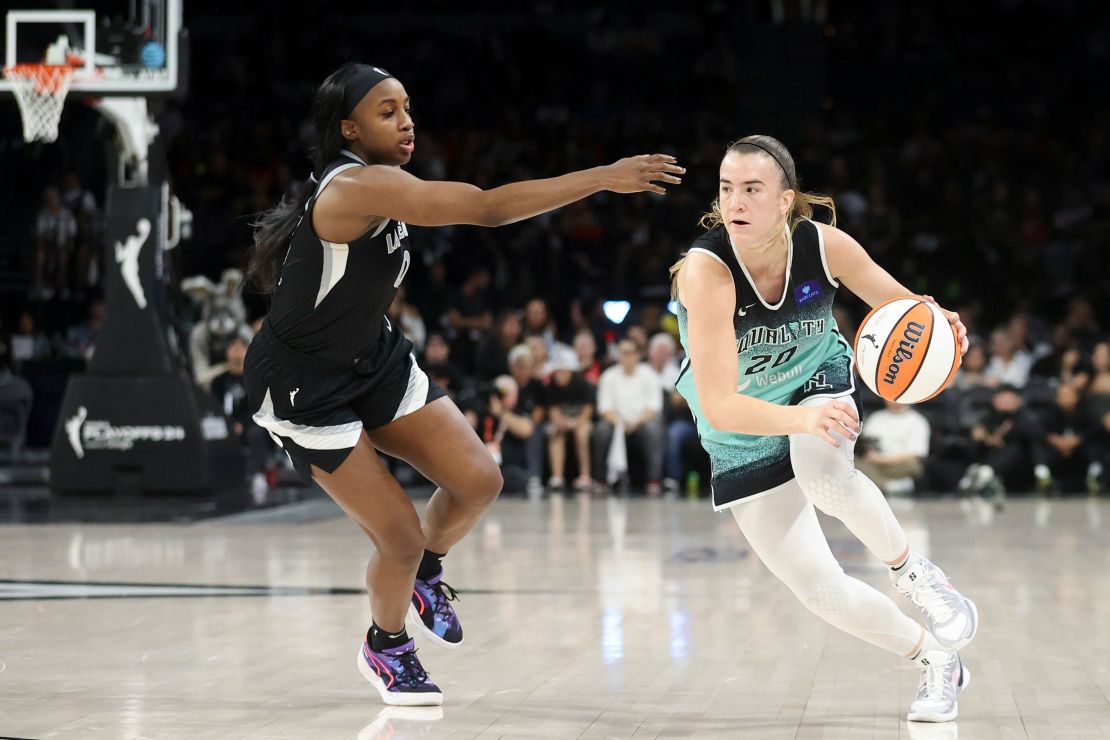 New York Liberty guard Sabrina Ionescu drives past Las Vegas Aces guard Jackie Young during the second half.