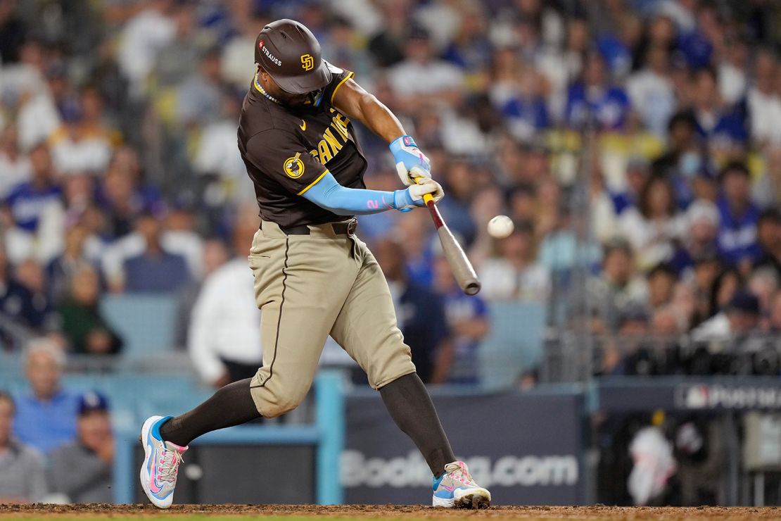 San Diego Padres' Xander Bogaerts connects for a solo home run during the eighth inning in Game 2 of a baseball playoff game against the Los Angeles Dodgers, Sunday, Oct. 6, 2024, in Los Angeles. (AP Photo/Mark J. Terrill)