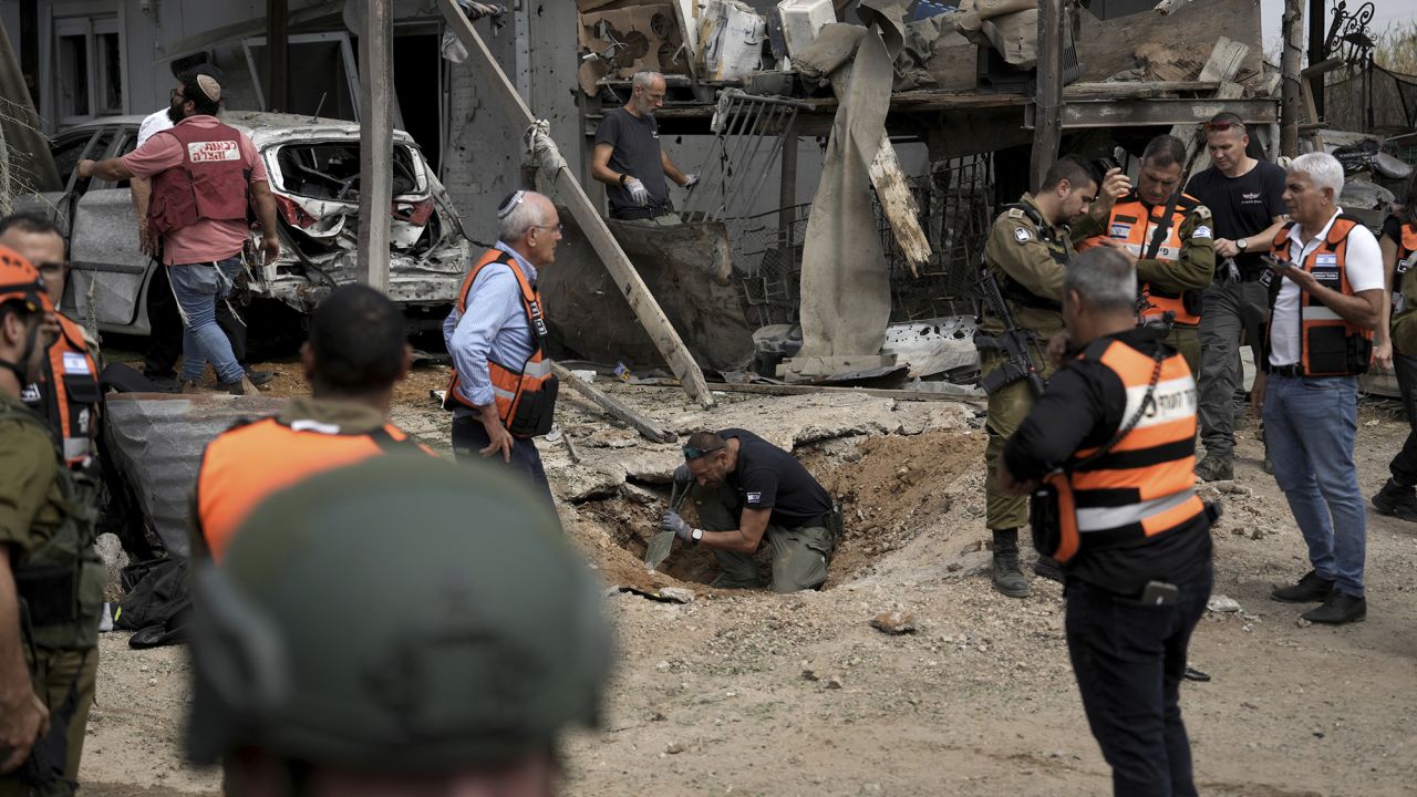 Emergency personnel inspect the area.