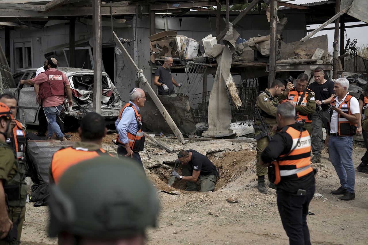 Emergency personnel inspect the area.