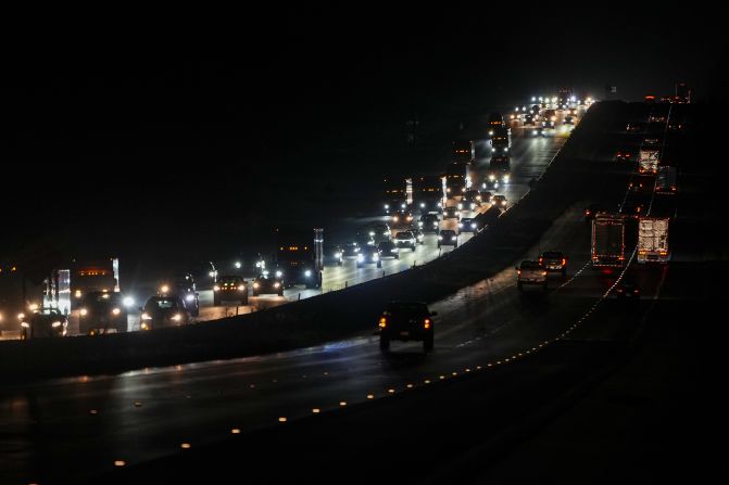 Heavy traffic flows northbound on Interstate 75 as people evacuate the Tampa Bay area late on Monday, October 7.