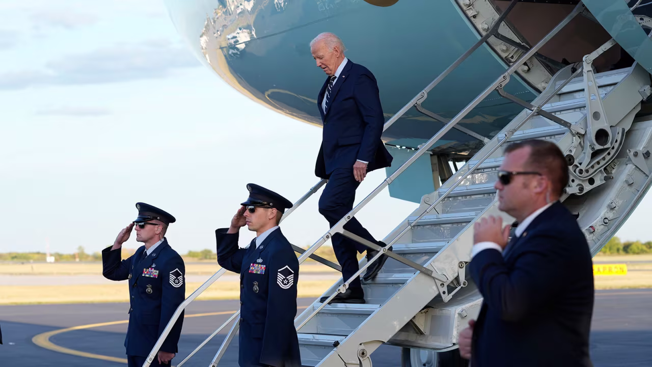 President Joe Biden walks down the steps of Air Force One at Philadelphia International Airport in Philadelphia, Tuesday, October 8, to attend a campaign event for Sen. Bob Casey.