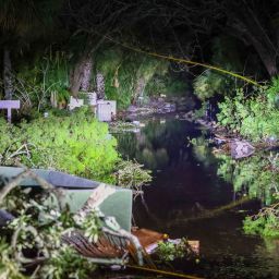 Debris along Commonwealth Drive clogs the roadway after Hurricane Milton made landfall nearby Thursday, Oct. 10, 2024 in Siesta Key, Fla.  (Chris Urso/Tampa Bay Times via AP)