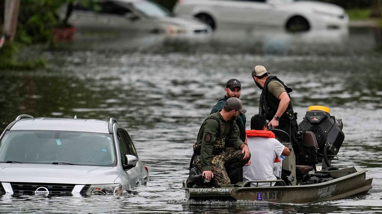 People are rescued from an apartment complex in the aftermath of Hurricane Milton on Thursday in Clearwater, Florida.