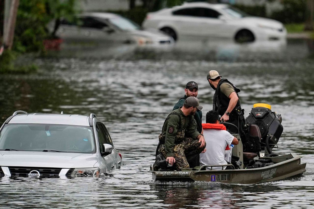 People are rescued from an apartment complex in the aftermath of Hurricane Milton on Thursday in Clearwater, Florida.