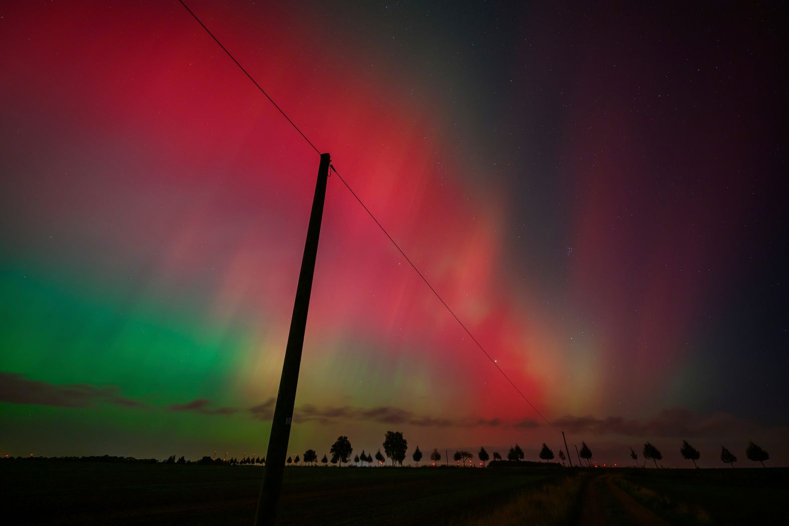 The northern lights glow over the landscape in eastern Brandenburg, Germany, on Thursday.