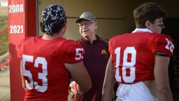 Vice Presidential candidate and Minnesota Gov. Tim Walz speaks to players on the Mankato West football team after they left the team tunnel Friday, Oct. 11, 2024 at Mankato West High School in Mankato, Minn. Gov. Walz visited Friday's Mankato East-West rivalry game. Walz was a defensive coach for Mankato West's 1999 state championship team.