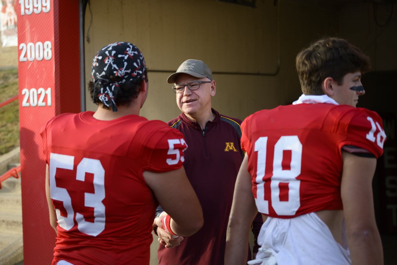 Minnesota Gov. Tim Walz speaks to players on the Mankato West High School football team in Mankato, Minnesota, on October 11.