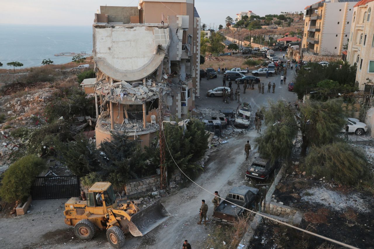 Lebanese soldiers deploy around a destroyed building hit by an Israeli airstrike, in Barja village, south of Beirut, on October 12.