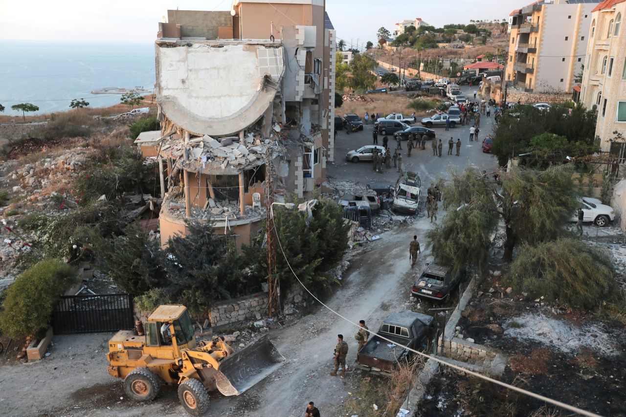 Lebanese army soldiers deploy around a building hit by an Israeli airstrike in Barja, Lebanon, on Saturday, October 12.