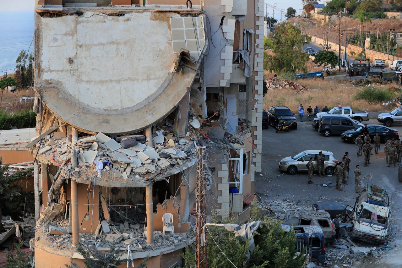 Lebanese army soldiers deploy around a building destroyed by an Israeli airstrike in Barja, Lebanon, on October 12.