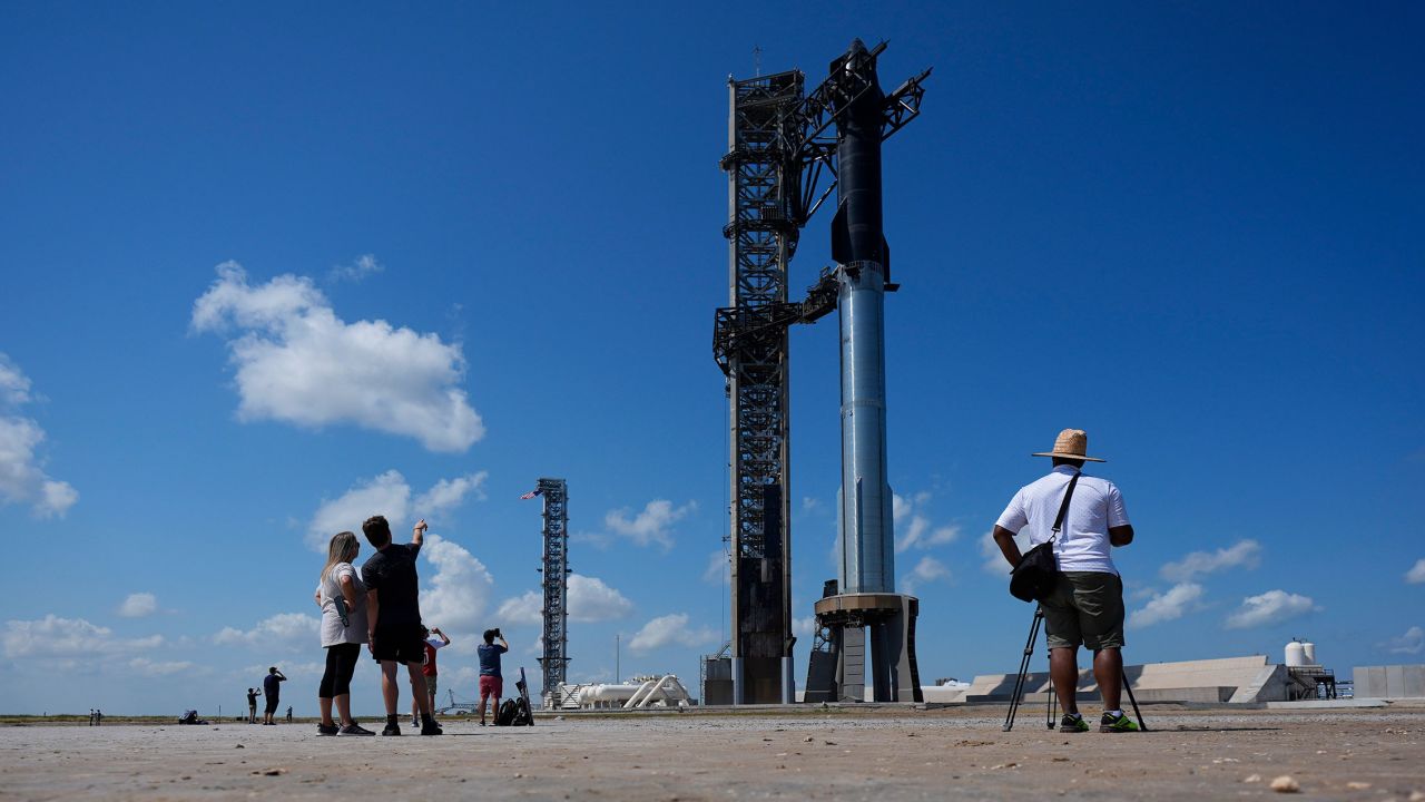 Onlookers watch as SpaceX's Starship rocket is prepared for a test launch in Boca Chica, Texas, on Saturday.