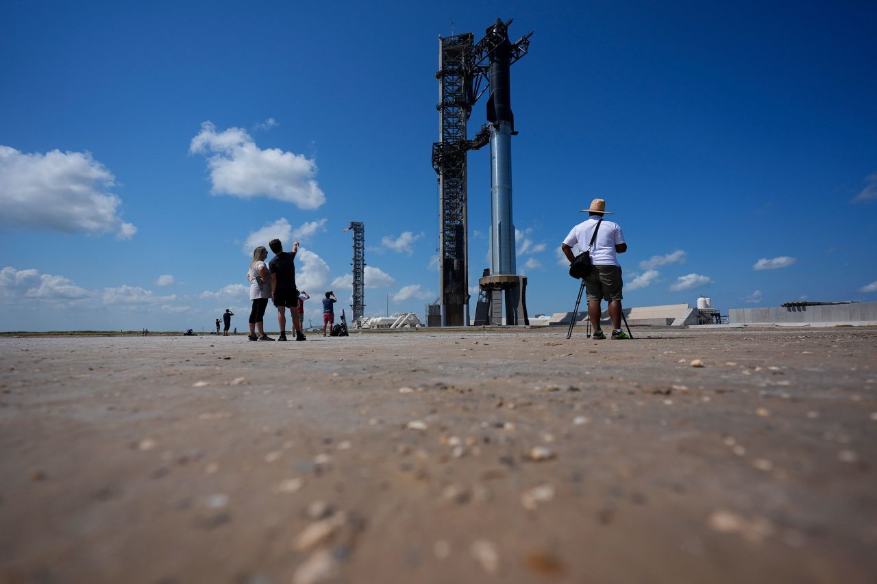 Onlookers watch as SpaceX's Starship rocket is prepared for a test launch in Boca Chica, Texas, on Saturday.