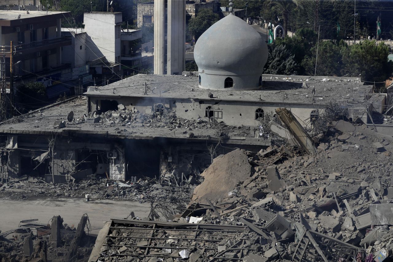 Destroyed shops and a mosque are seen after Israeli airstrikes hit a commercial street in Nabatiyeh, Lebanon, on October 13.