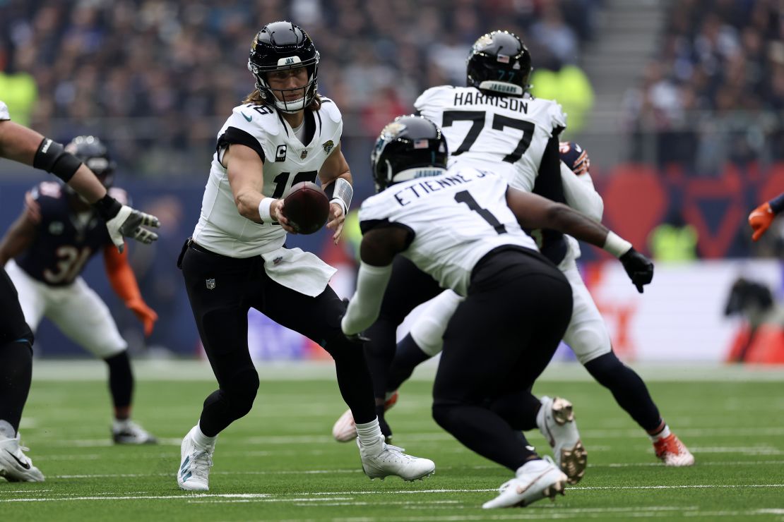 Lawrence hands the ball off during the game.