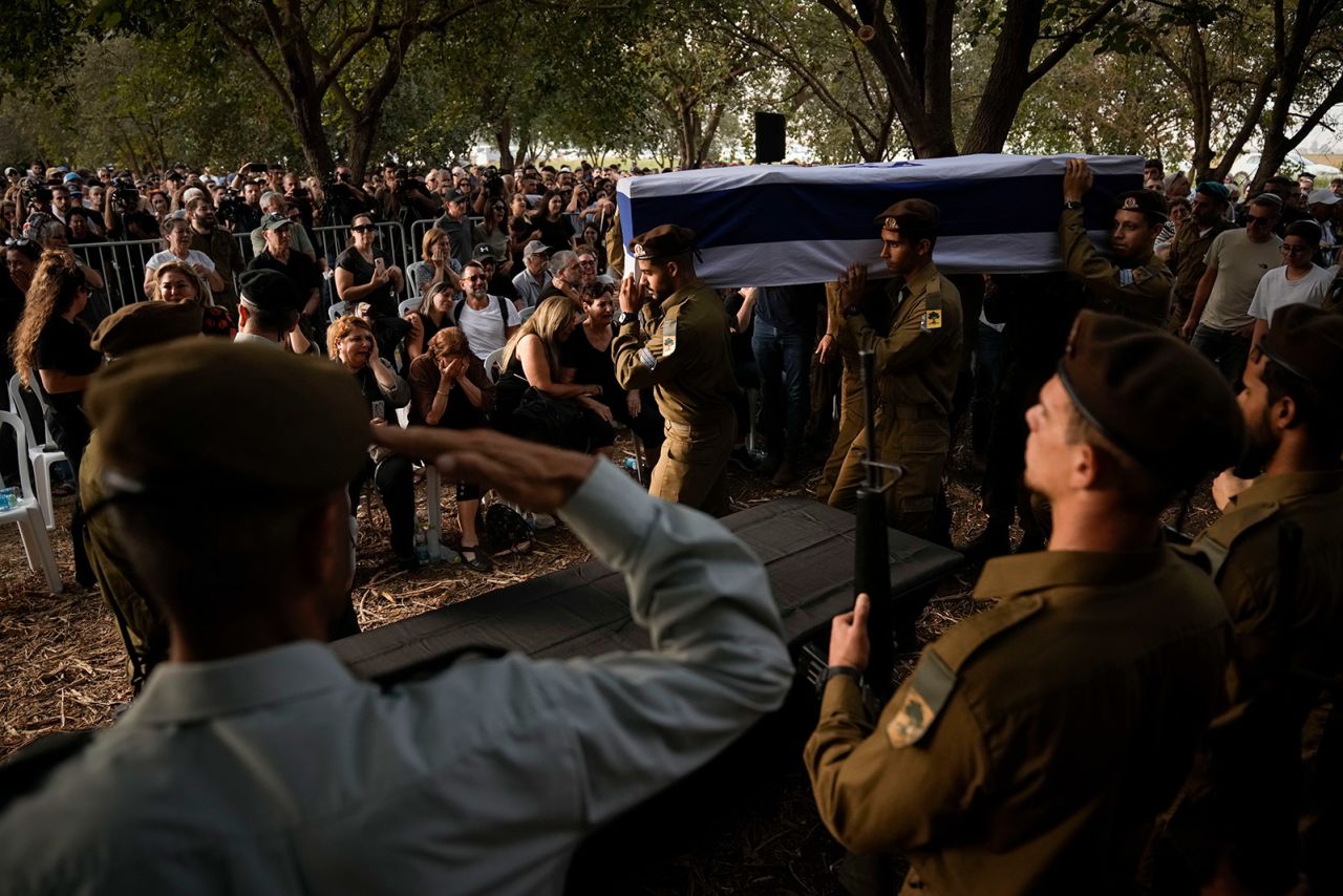 Israeli soldiers carry the flagged-covered coffin of Sgt. Amitai Alon, killed by a Hezbollah drone attack, during his funeral near Ramot Naftali, Israel, on October 14, 2024.