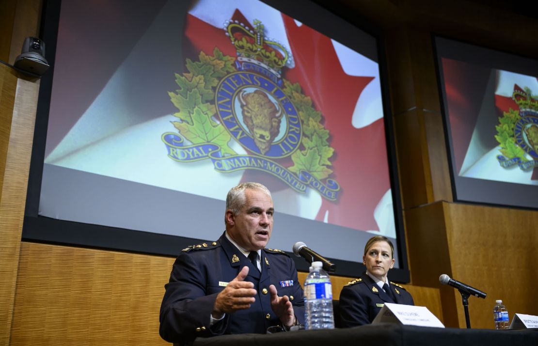 RCMP Commissioner Mike Duheme, left, and Assistant Commissioner Brigitte Gauvin take part in a news conference at RCMP National Headquarters in Ottawa on Oct. 14, 2024.