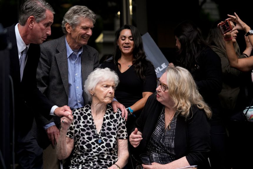 Kitty Menendez' sister Joan Andersen VanderMolen, bottom left, and niece Karen VanderMolen, right, sit together during a news conference on October 16, 2024.