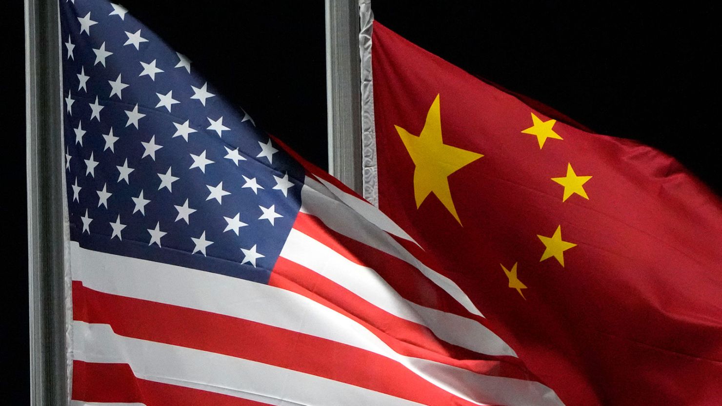 The American and Chinese flags wave at Genting Snow Park, in February 2022, in Zhangjiakou, China.