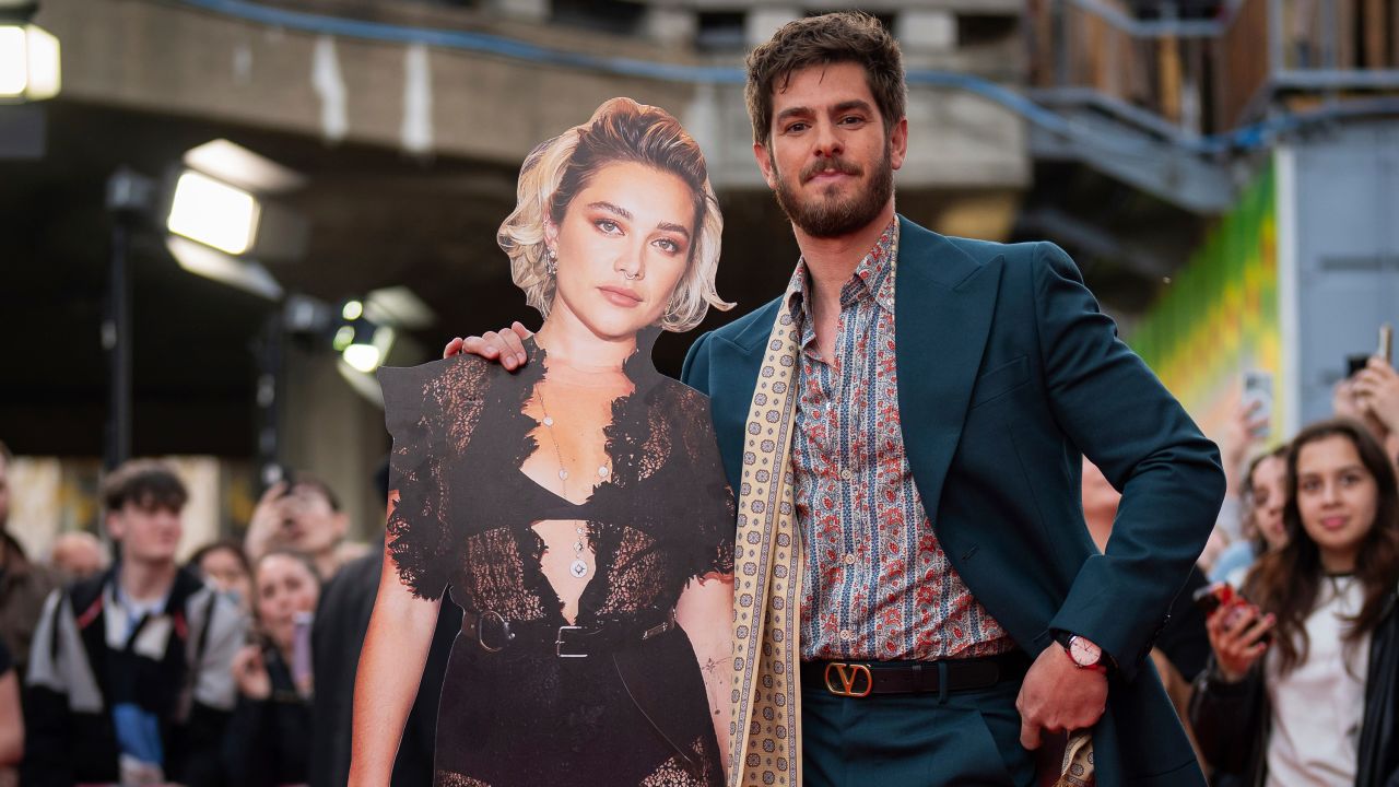 Andrew Garfield poses with a cut out of fellow actor Florence Pugh upon arrival at the premiere for the film 'We Live In Time' on Thursday, Oct. 17, 2024, in London.