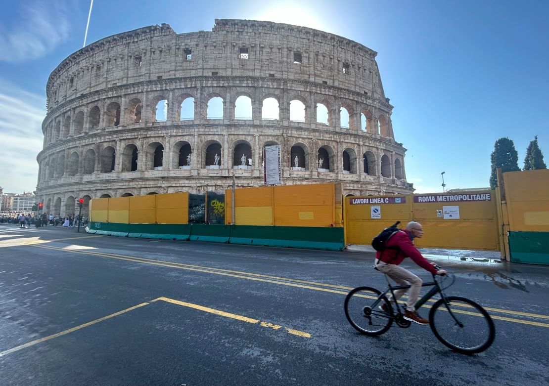 A cyclist in front of Rome's Colosseum on October 18.