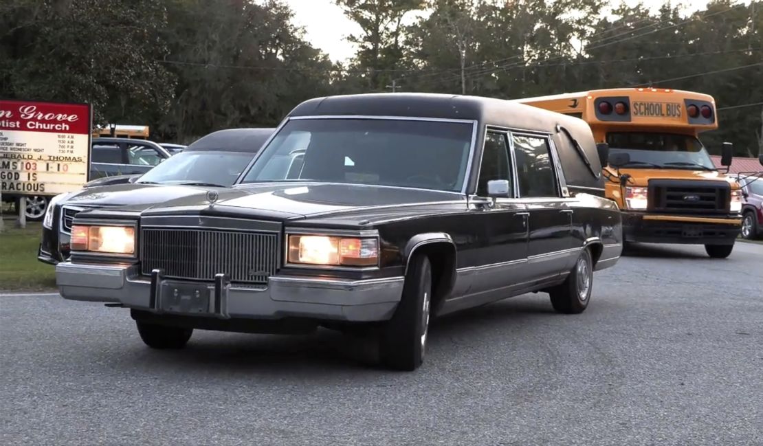 A hearse heads to Meridian Dock in McIntosh County where seven people died after a gangway collapsed, plunging them into the water on Sapelo Island, Georgia.