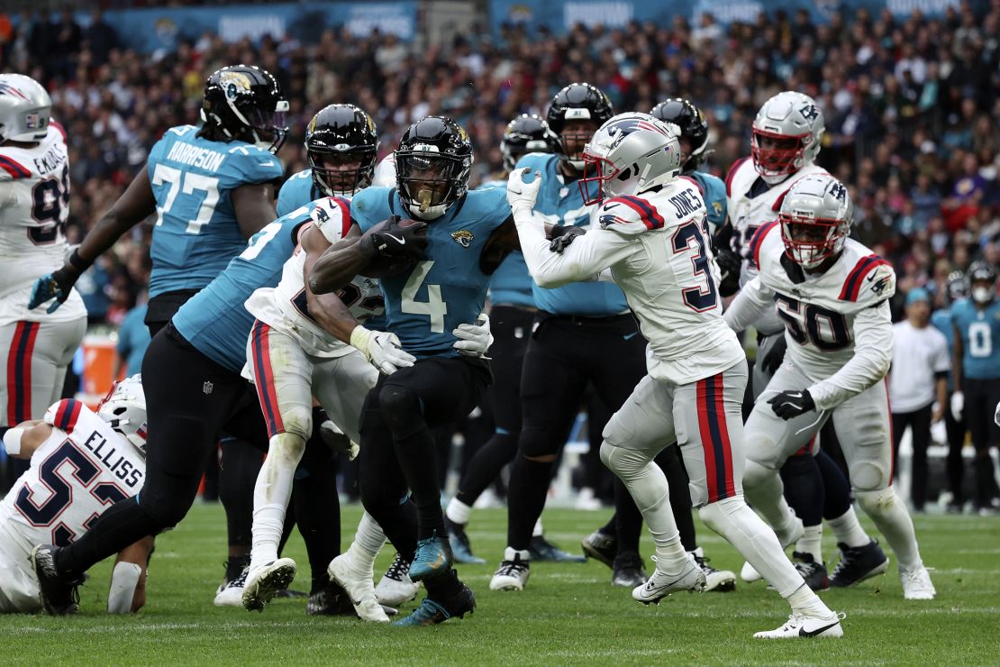 Jacksonville Jaguars running back Tank Bigsby rushes for his first touchdown against the New England Patriots.