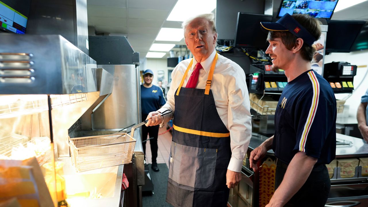 Republican presidential nominee former President Donald Trump works behind the counter during a visit to McDonald's in Feasterville-Trevose, Pa., Sunday, Oct. 20, 2024.