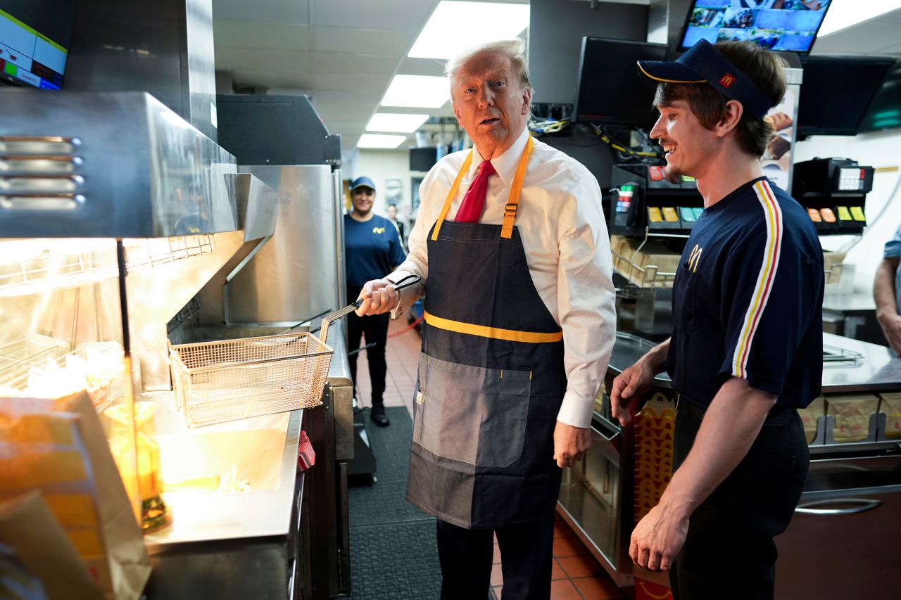 Former President Donald Trump works behind the counter during a visit to McDonald's in Feasterville-Trevose, Pennsylvania, on Sunday, October 20.