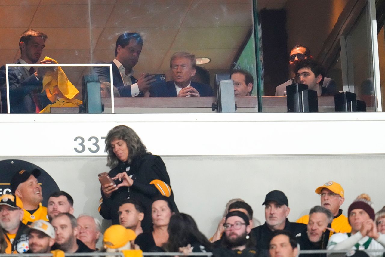 Donald Trump watches the first half of an NFL football game between the Pittsburgh Steelers and the New York Jets in Pittsburgh, on October 20.