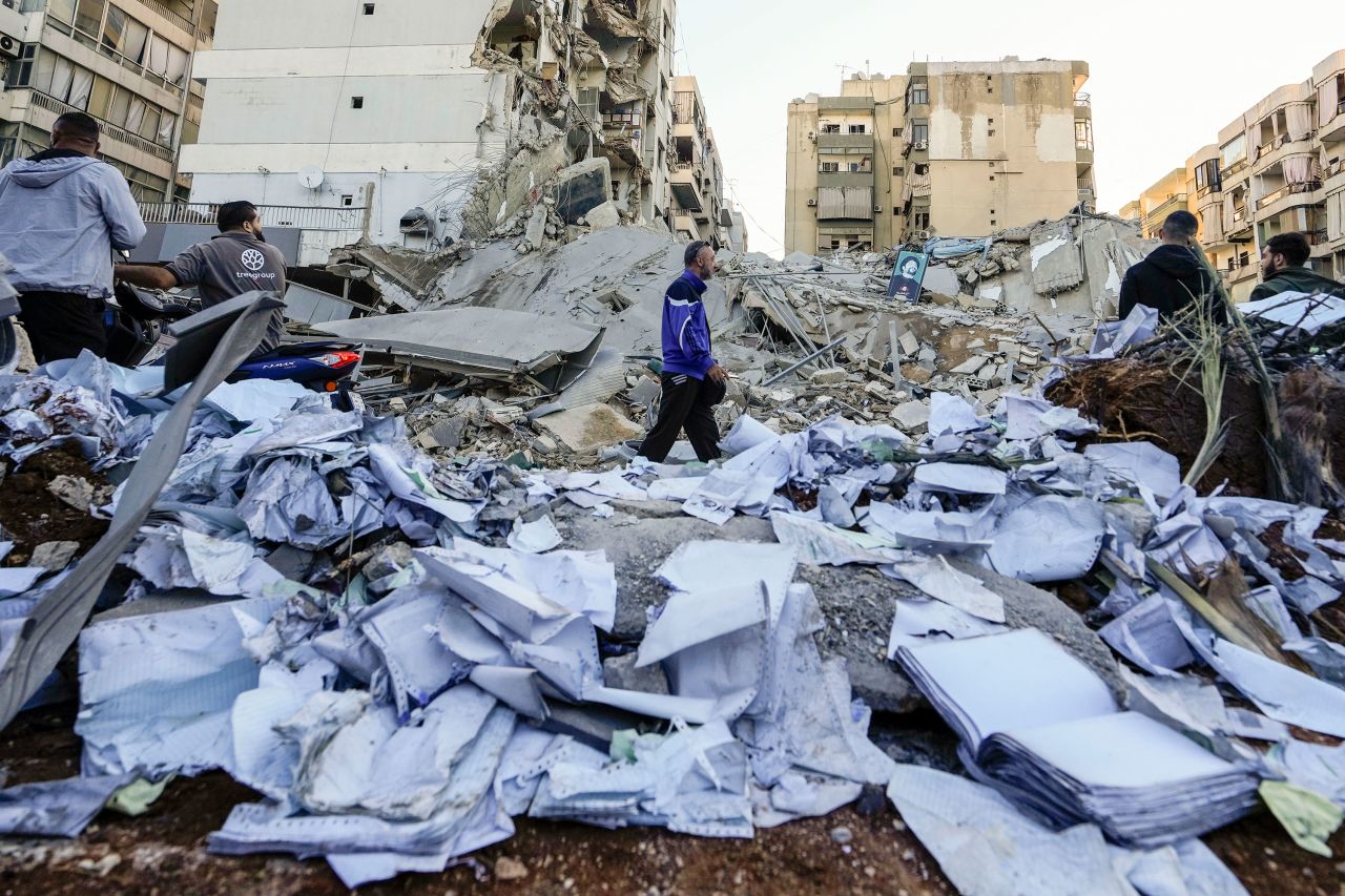 Documents of Hezbollah-affiliated bank Qard al-Hassan are scattered at the site of an Israeli airstrike in Beirut, Lebanon, on Monday.