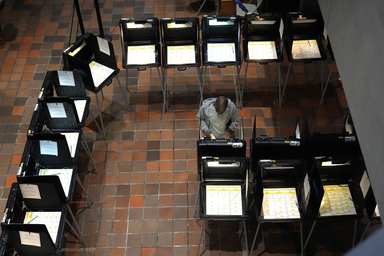 A voter casts a ballot on the first day of early voting in Miami on October 21.