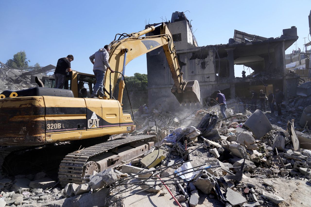 A bulldozer clears the rubble of destroyed buildings following Israeli airstrikes in a densely-populated neighbourhood facing the Rafik Hariri State Hospital in Beirut, Lebanon, on October 22.