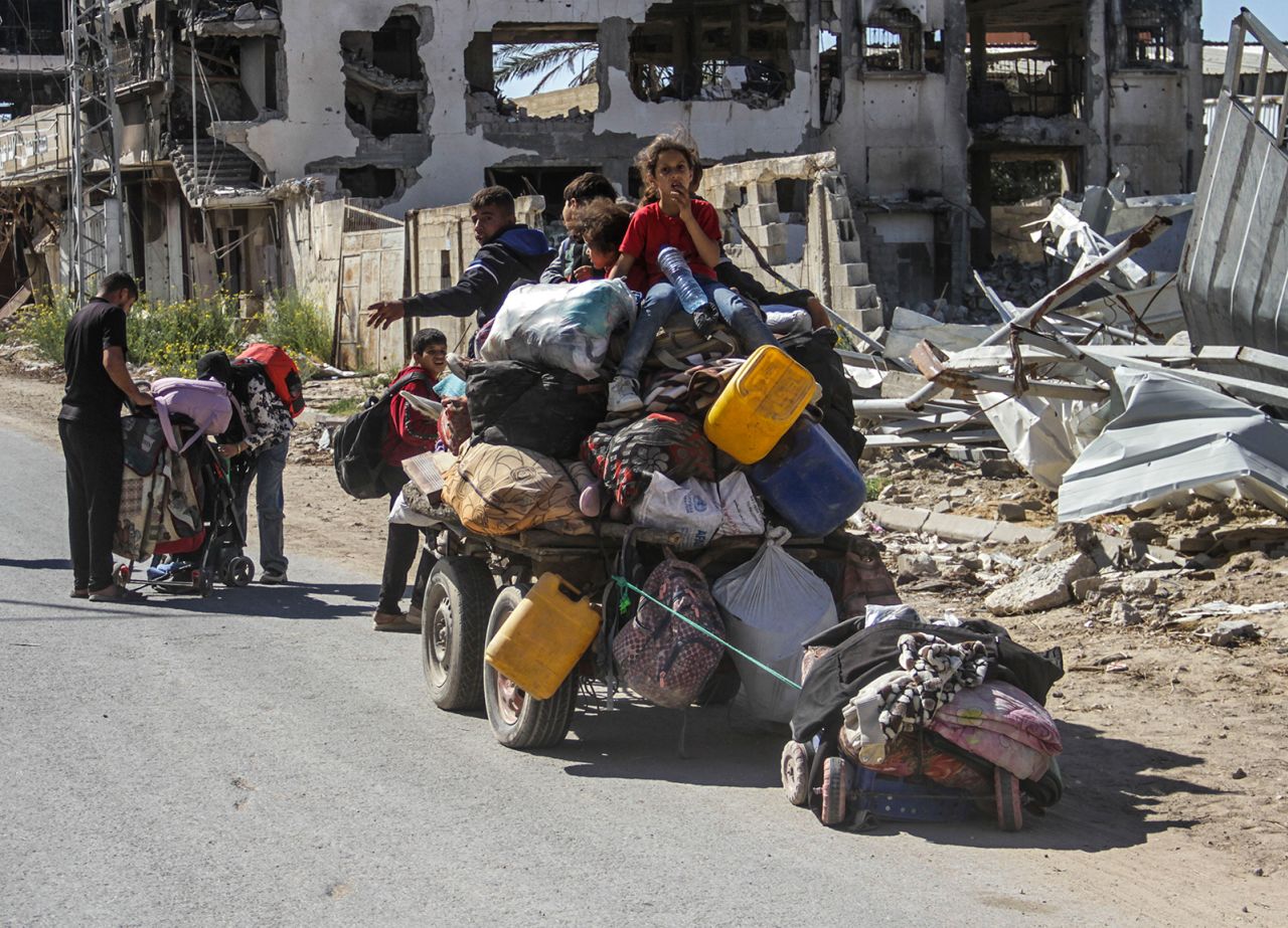 Displaced Palestinians flee with their families and belongings after an order to evacuate the northern part of Gaza by the Israeli military, in Jabalya, northern Gaza on October 22.