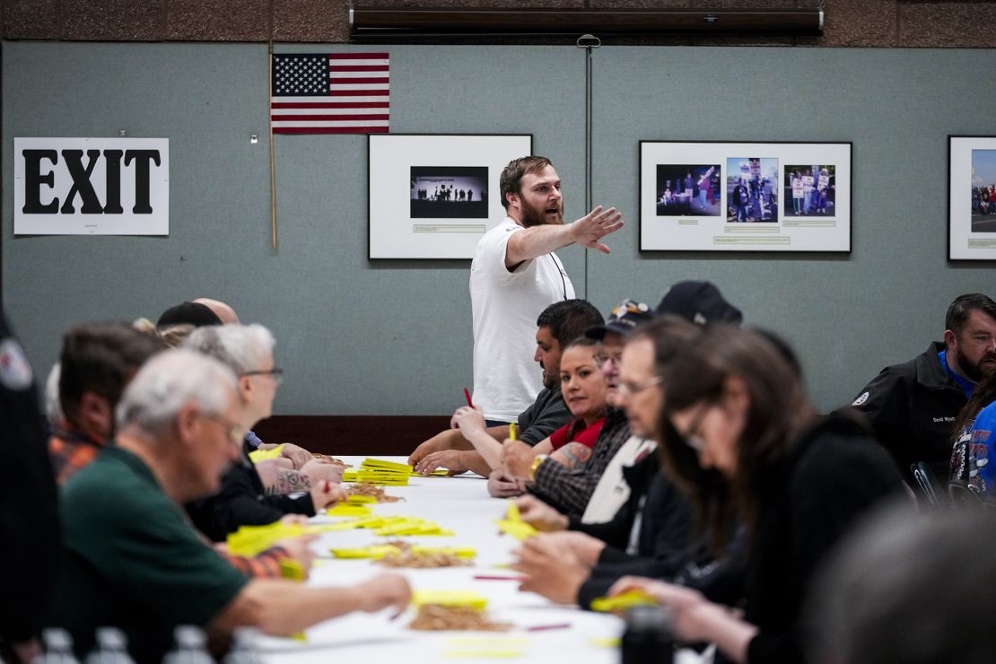 Volunteers tally votes on a new contract offer from Boeing Wednesday night at a union hall in Seattle.