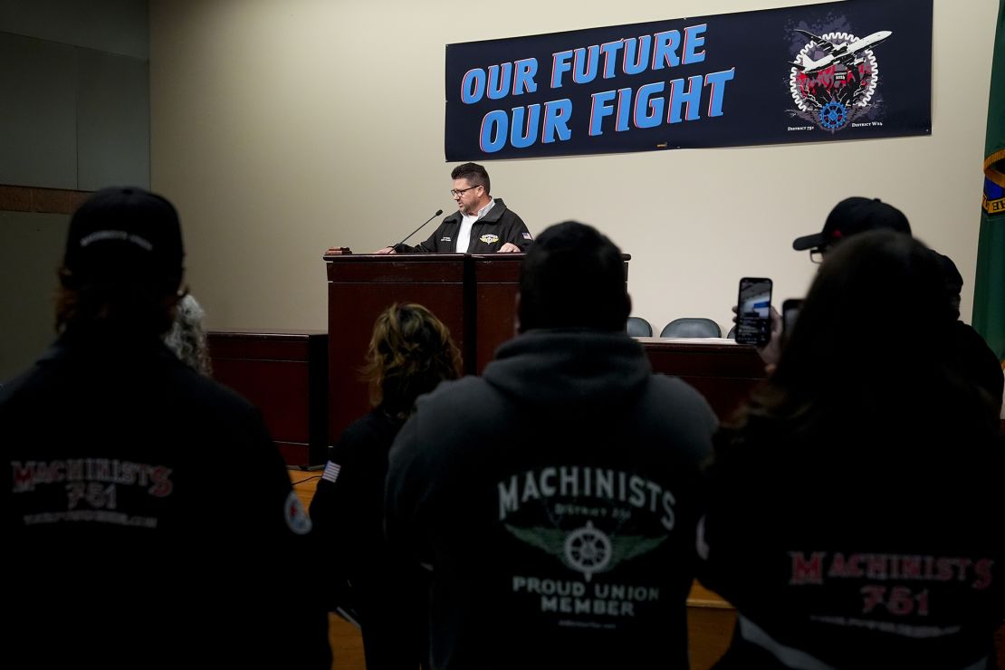 IAM District 751 president Jon Holden speaks to union members while announcing that they voted to reject a new contract offer from Boeing on October 23.