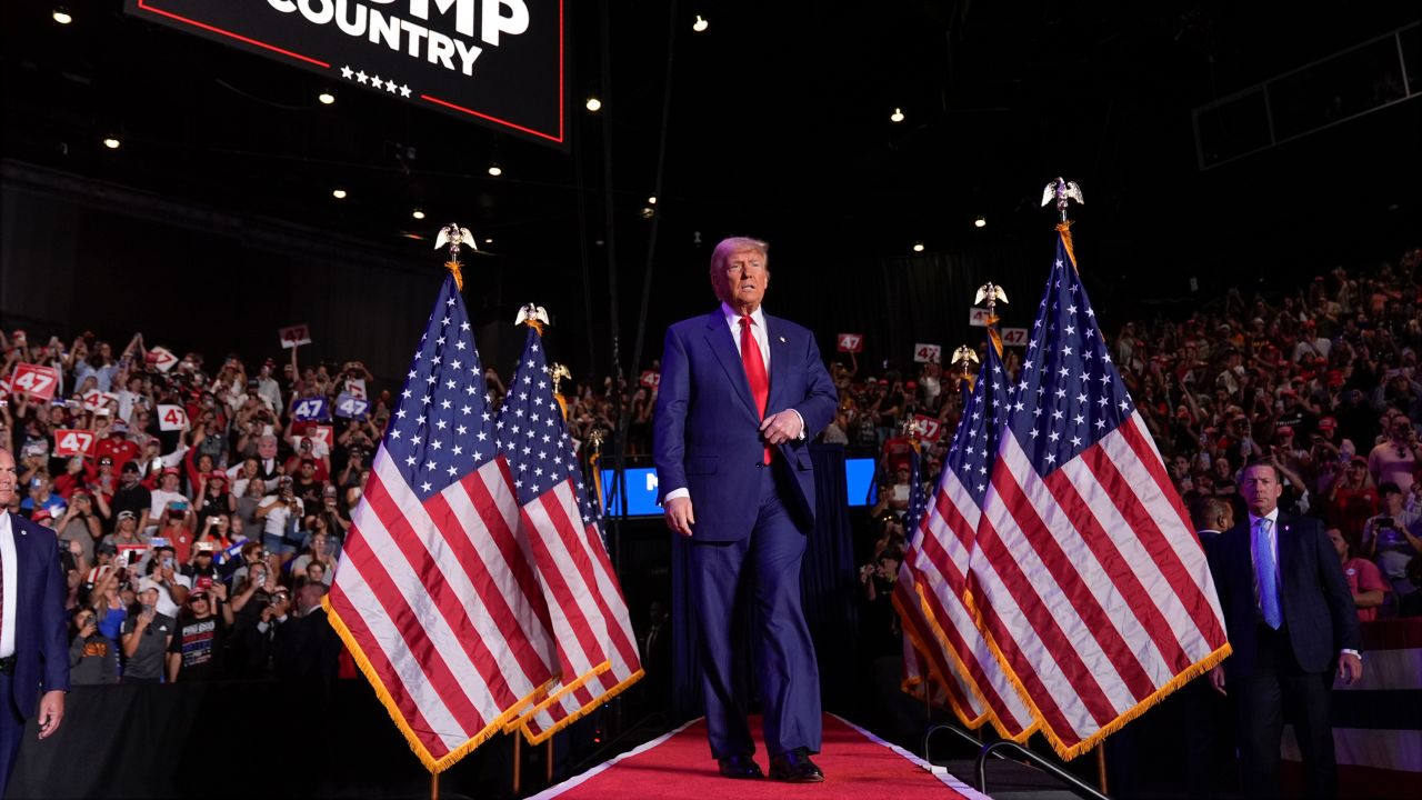 Republican presidential nominee and former President Donald Trump arrives at a campaign rally at Mullett Arena, in Tempe, Arizona, on October 24.