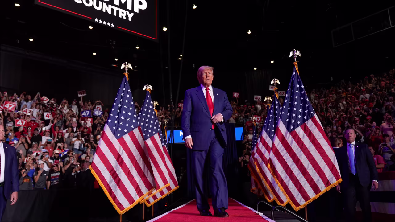Republican presidential nominee and former President Donald Trump arrives at a campaign rally at Mullett Arena, in Tempe, Arizona, on October 24.
