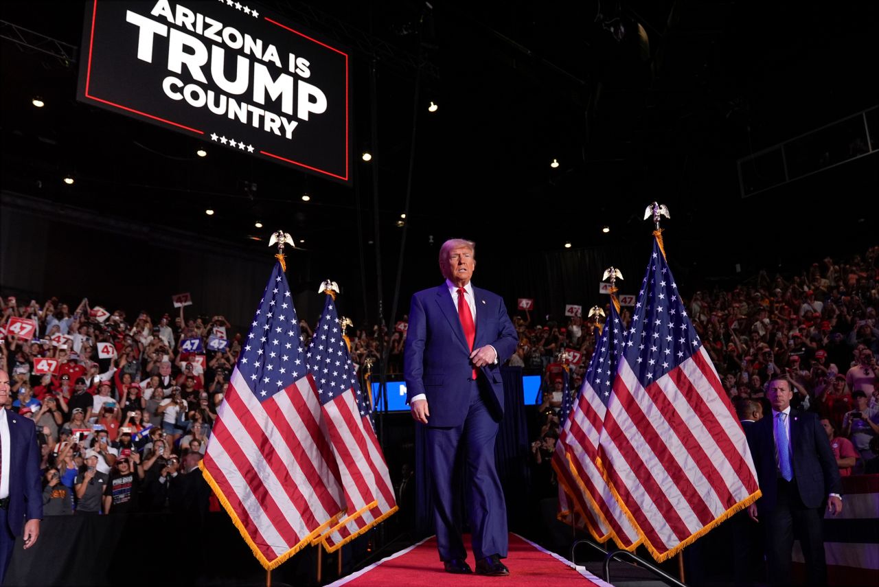 Republican presidential nominee and former President Donald Trump arrives at a campaign rally at Mullett Arena, in Tempe, Arizona, on October 24.