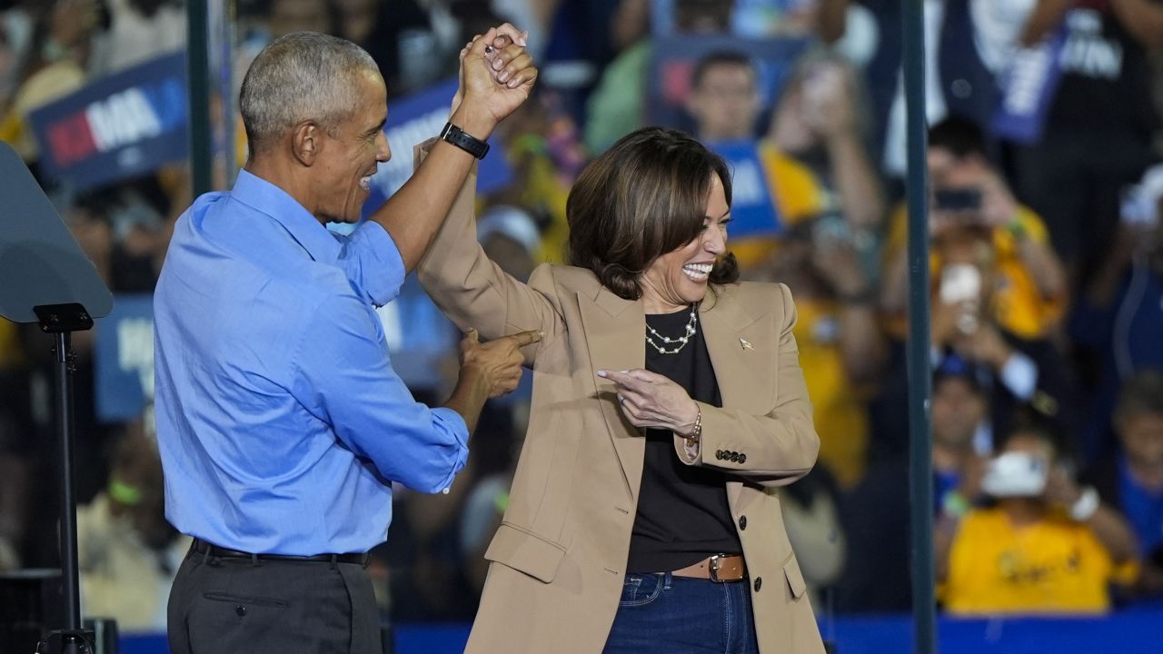 Former President Barack Obama gestures to Democratic presidential nominee Vice President Kamala Harris after introducing her to speak during a campaign rally in Clarkston, Georgia on October 24.