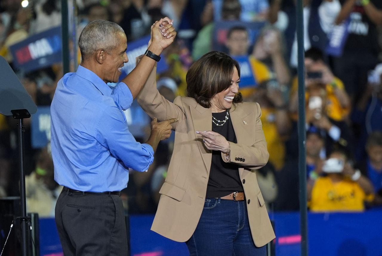 Former President Barack Obama gestures to Democratic presidential nominee Vice President Kamala Harris after introducing her to speak during a campaign rally in Clarkston, Georgia on October 24.