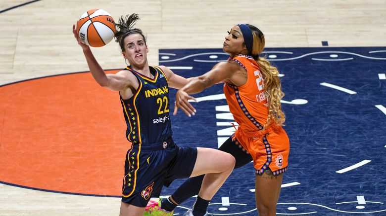 September 22, 2024: Indiana Fever guard Caitlin Clark (22) handles the ball while defended by Connecticut Sun guard/forward DiJonai Carrington (21) during game 1 of the first round of the WNBA playoffs between the Indiana Fever and the Connecticut Sun at Mohegan Sun Arena in Uncasville, Connecticut. Erica Denhoff/CSM (Credit Image: © Erica Denhoff/Cal Sport Media) (Cal Sport Media via AP Images)