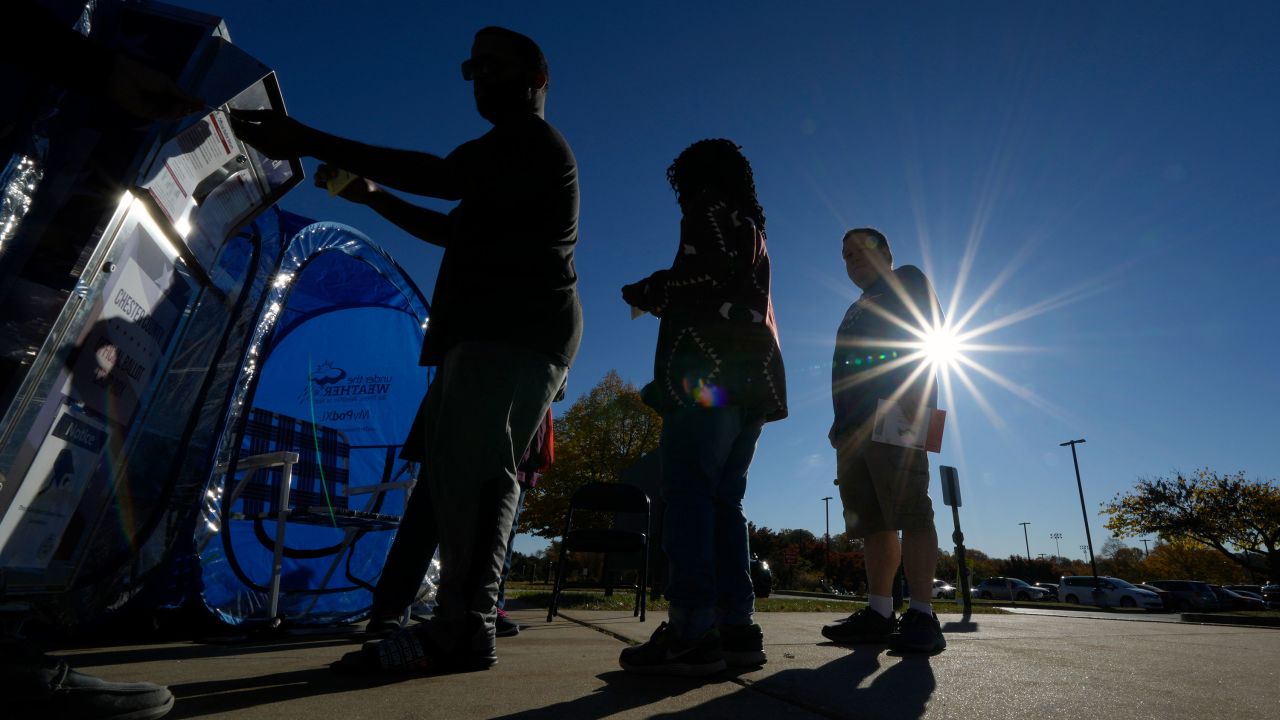 Voters return their mail-in ballots for the 2024 General Election in the United States outside the Chester County Government Services Center, Friday, Oct. 25, 2024, in West Chester, Pa. (AP Photo/Matt Slocum)
