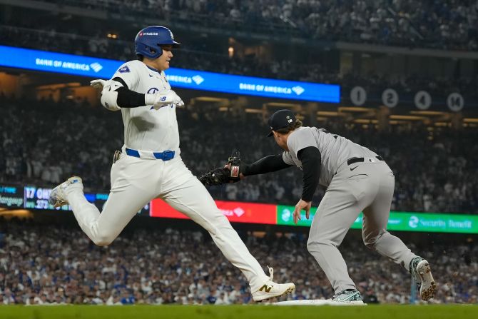 Shohei Ohtani of the Dodgers is forced out by Yankees first baseman Anthony Rizzo during the sixth inning.