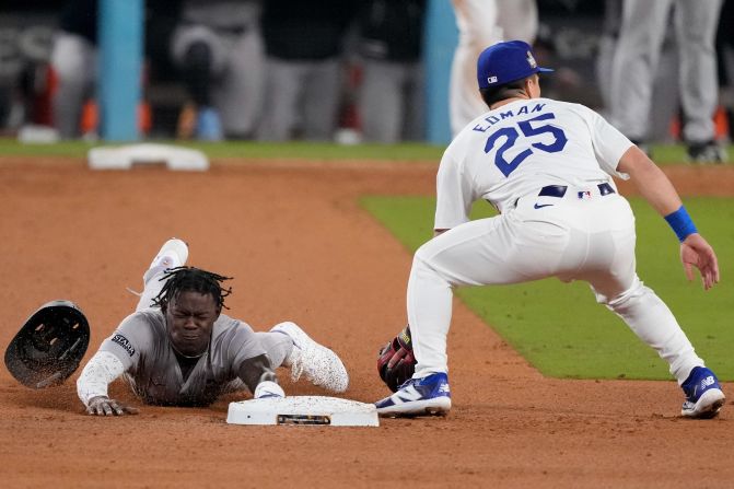 Jazz Chisholm Jr. of the Yankees steals second base during the tenth inning of Game 1.