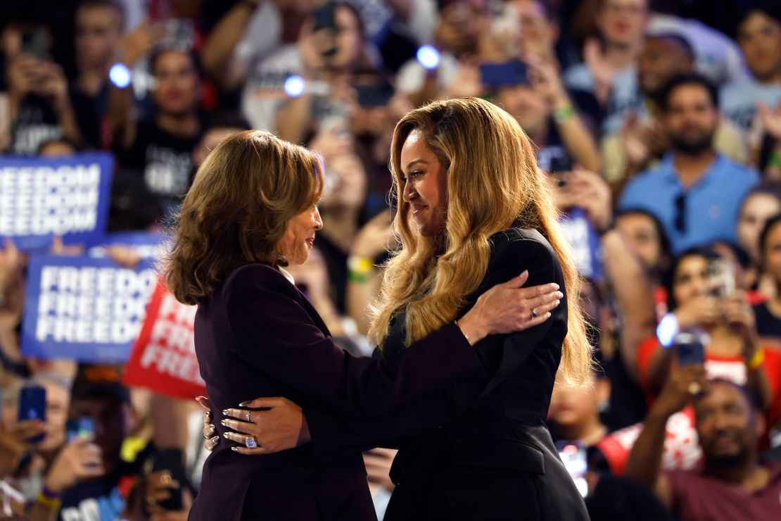 Beyoncé (right) and Vice President Kamala Harris embrace during a rally in Houston on October 25, 2024.