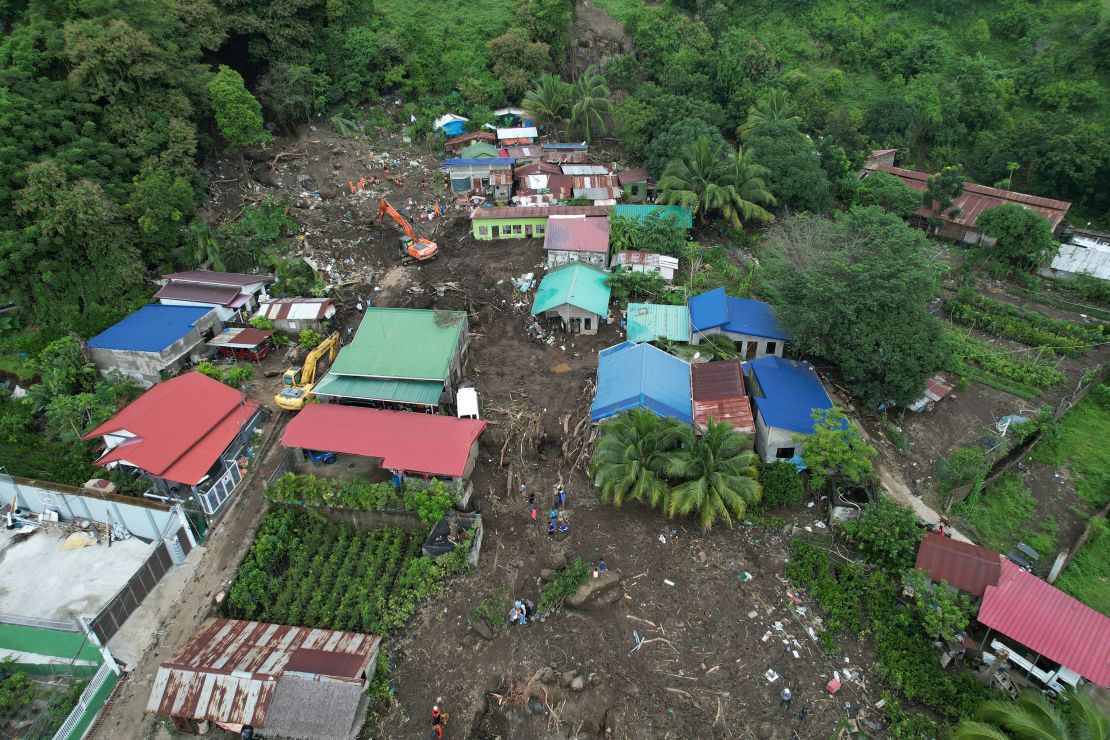 Rescuers search for bodies after a landslide triggered by Tropical Storm Trami struck homes in Talisay, Batangas province, Philippines on Oct. 26, 2024.