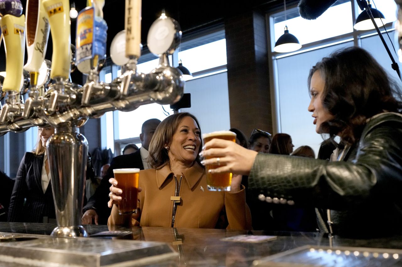 Vice President Kamala Harris, left, and Michigan Gov. Gretchen Whitmer speak at the Trak Houz Bar & Grill after a campaign rally in Kalamazoo, Michigan, on Saturday.