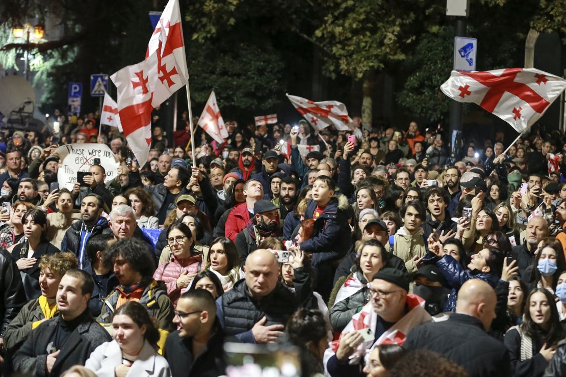 Demonstrators wave Georgian national flags at the protest in Tbilisi on Monday.