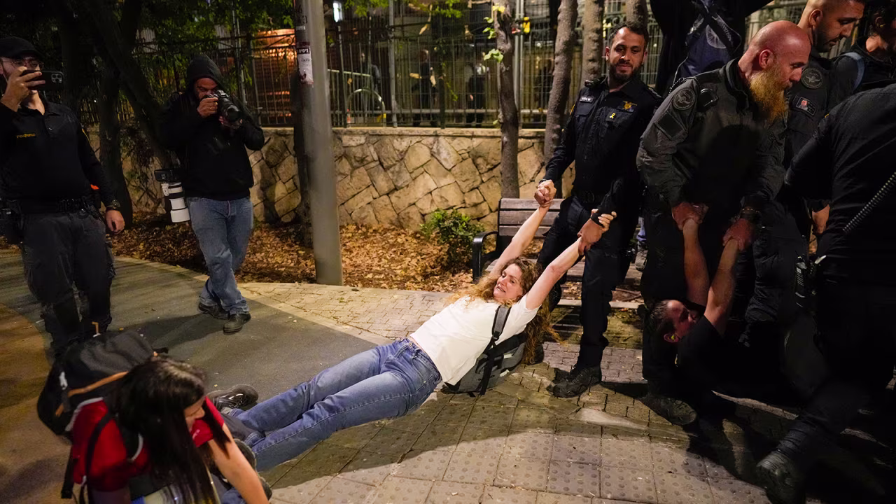 Police disperse protesters near the prime minister's residence in Jerusalem on Monday.